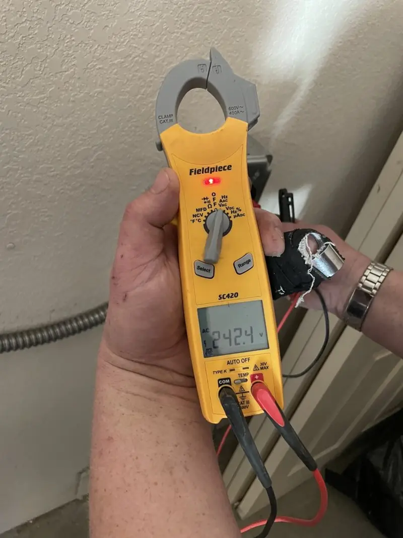 Voltage testing with clamp meter during Ceiling Fan Installation in Redford